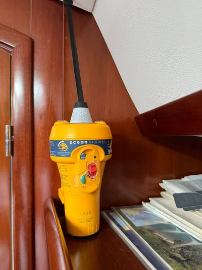  Yacht Photos Pics EPIRB device on 2004 Beneteau 50 yacht interior, mounted on wooden panel.