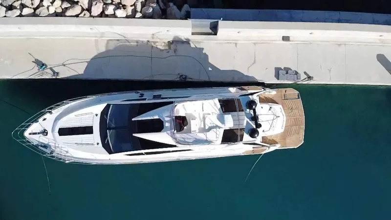  Yacht Photos Pics Overhead view of 2010 Galeon 700 Raptor SkyDeck yacht docked at a marina.