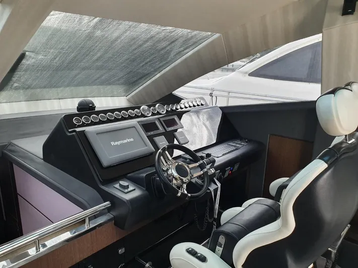  Yacht Photos Pics Cockpit of 2010 Galeon 700 Raptor SkyDeck with Raymarine navigation system.