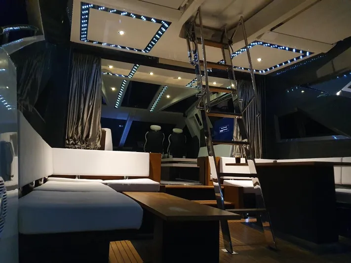  Yacht Photos Pics Luxurious interior of 2010 Galeon 700 Raptor SkyDeck yacht with modern seating and lighting.