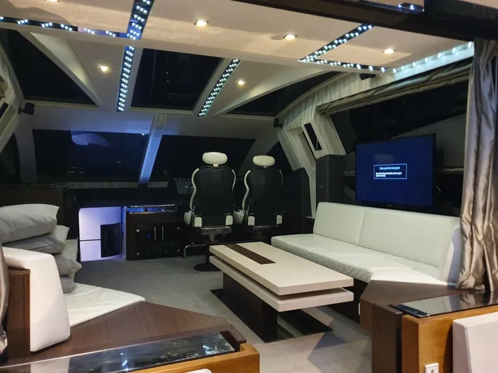  Yacht Photos Pics Luxurious interior of 2010 Galeon 700 Raptor SkyDeck yacht with modern seating and ambient lighting.