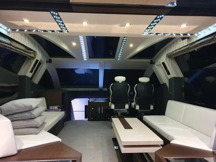  Yacht Photos Pics Luxurious interior of 2010 Galeon 700 Raptor SkyDeck yacht with modern seating and ambient lighting.