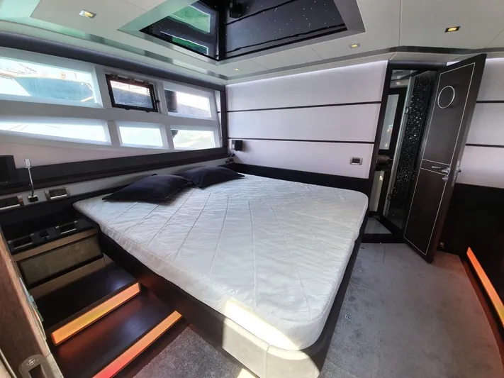  Yacht Photos Pics Luxurious bedroom interior of 2010 Galeon 700 Raptor SkyDeck yacht.