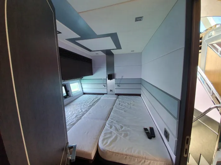  Yacht Photos Pics Interior cabin of 2010 Galeon 700 Raptor SkyDeck yacht with twin beds and modern design.
