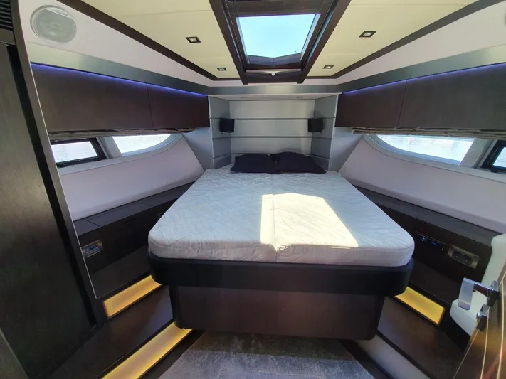  Yacht Photos Pics Luxurious bedroom interior of 2010 Galeon 700 Raptor SkyDeck yacht with modern design.