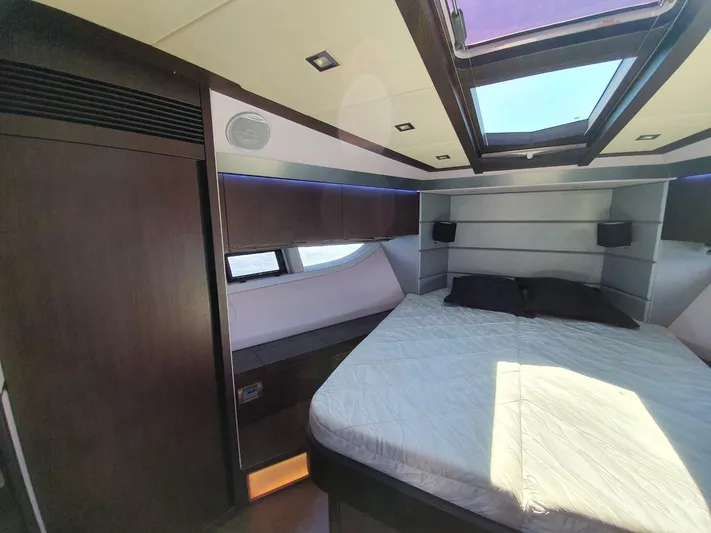  Yacht Photos Pics Luxurious bedroom interior of 2010 Galeon 700 Raptor SkyDeck yacht with skylight and modern design.