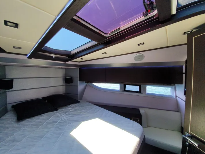  Yacht Photos Pics Luxurious cabin interior of 2010 Galeon 700 Raptor SkyDeck yacht with skylight and modern design.