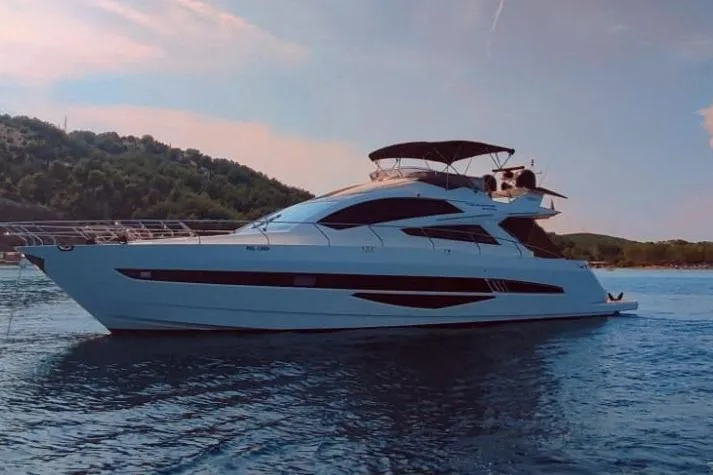  Yacht Photos Pics 2010 Galeon 700 Raptor SkyDeck yacht cruising on serene waters.