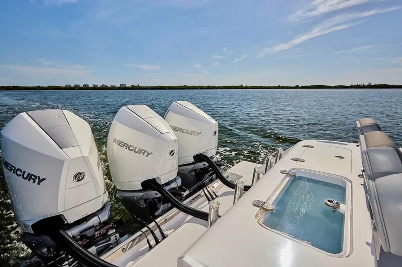  Yacht Photos Pics 2022 Bluewater 35 boat with triple Mercury engines on open water.