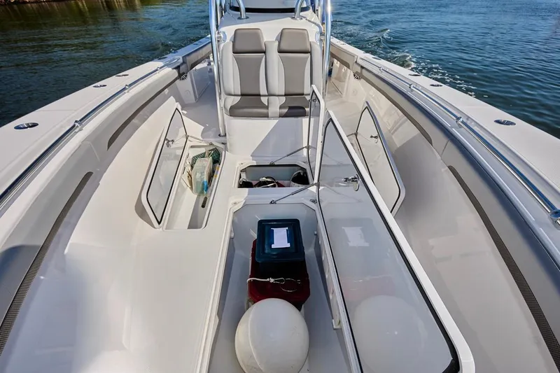  Yacht Photos Pics 2022 Bluewater 35 boat interior with open storage compartments on calm water.