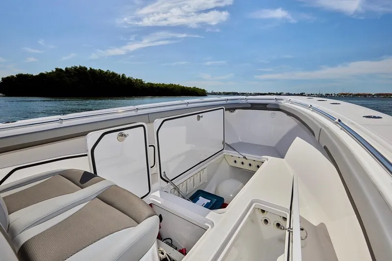  Yacht Photos Pics 2022 Bluewater 35 boat interior with open storage compartments, scenic water view.