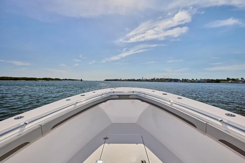  Yacht Photos Pics Bow view of 2022 Bluewater 35 boat cruising on a sunny day.