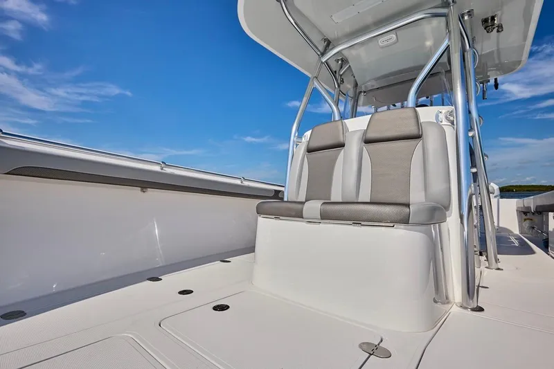  Yacht Photos Pics 2022 Bluewater 35 boat interior with sleek seating and modern design under clear blue sky.