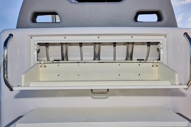  Yacht Photos Pics 2022 Bluewater 35 boat storage compartment with stainless steel rod holders.