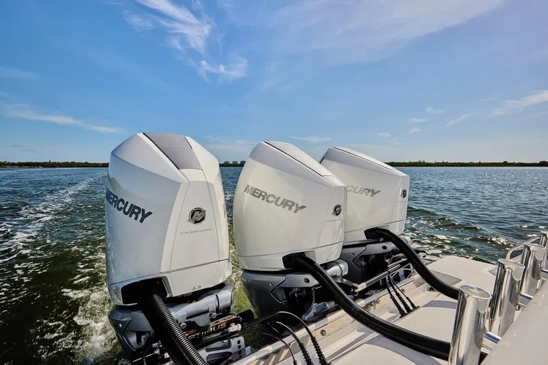 Yacht Photos Pics Triple Mercury outboard engines on a 2022 Bluewater 35 boat, cruising on open water.