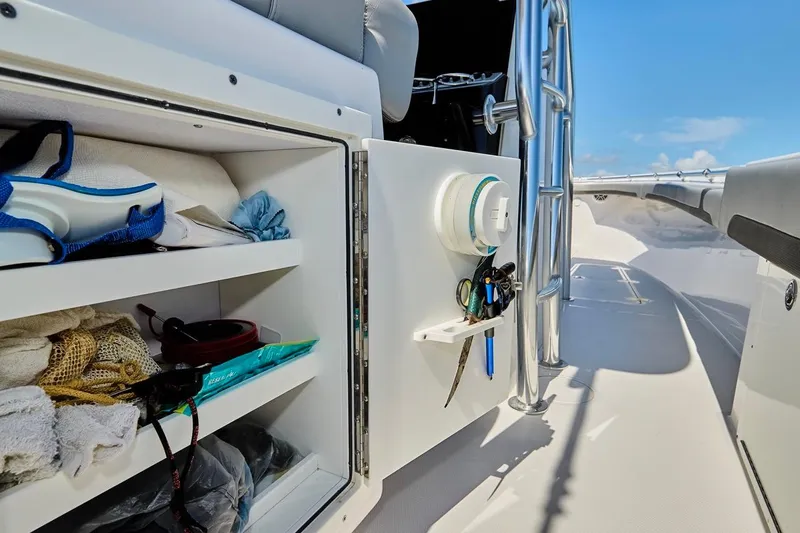  Yacht Photos Pics 2022 Bluewater 35 boat interior storage with shelves and equipment, under clear blue sky.