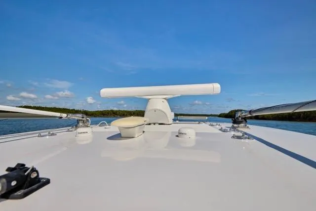  Yacht Photos Pics 2022 Bluewater 35 boat deck with radar, calm waters, and clear blue sky.