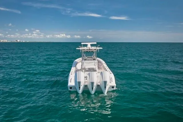  Yacht Photos Pics 2022 Bluewater 35 boat on open ocean under clear blue sky.