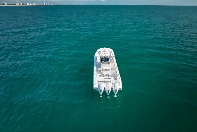  Yacht Photos Pics Aerial view of 2022 Bluewater 35 boat cruising on open ocean.