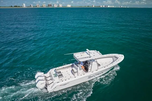  Yacht Photos Pics 2022 Bluewater 35 boat cruising on open ocean with distant shoreline.