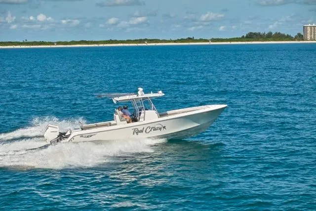  Yacht Photos Pics 2022 Bluewater 35 boat cruising on open water under a clear sky.