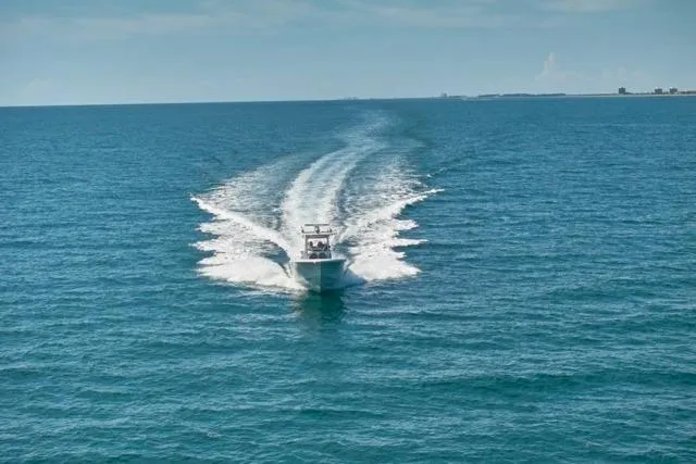  Yacht Photos Pics Bluewater 35 boat cruising on open sea, 2022 model, leaving a wake behind.