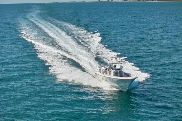  Yacht Photos Pics Bluewater 35 boat cruising on open sea, 2022 model, leaving a wake behind.