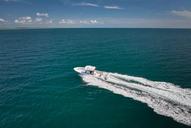  Yacht Photos Pics Bluewater 35 boat cruising on open ocean, 2022 model, under clear blue sky.