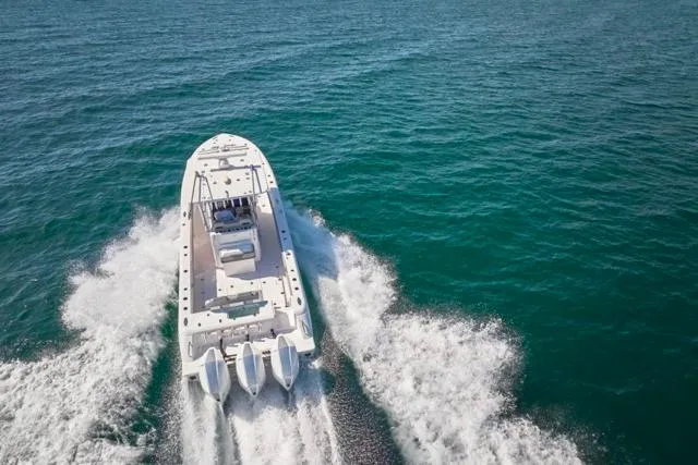  Yacht Photos Pics Aerial view of 2022 Bluewater 35 boat cruising on open sea.