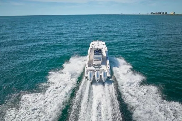  Yacht Photos Pics Bluewater 35 boat cruising on open sea, 2022 model, rear view.