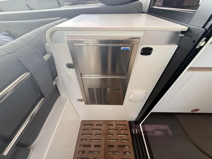 Darla Jay Yacht Photos Pics Interior of 2023 Fountaine Pajot Aura 51 yacht, featuring a compact stainless steel appliance.