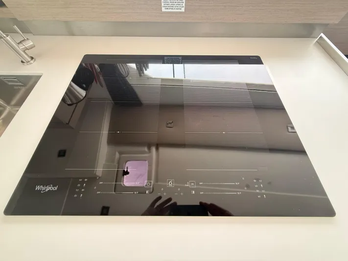 Darla Jay Yacht Photos Pics Modern Whirlpool induction cooktop on Fountaine Pajot Aura 51 yacht, 2023 model.