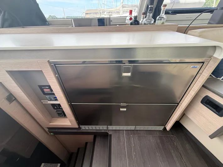 Darla Jay Yacht Photos Pics Modern kitchen area in 2023 Fountaine Pajot Aura 51 yacht with stainless steel appliances.