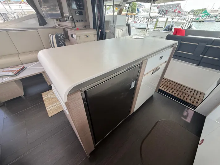 Darla Jay Yacht Photos Pics Interior of 2023 Fountaine Pajot Aura 51 yacht with modern kitchen and seating area.