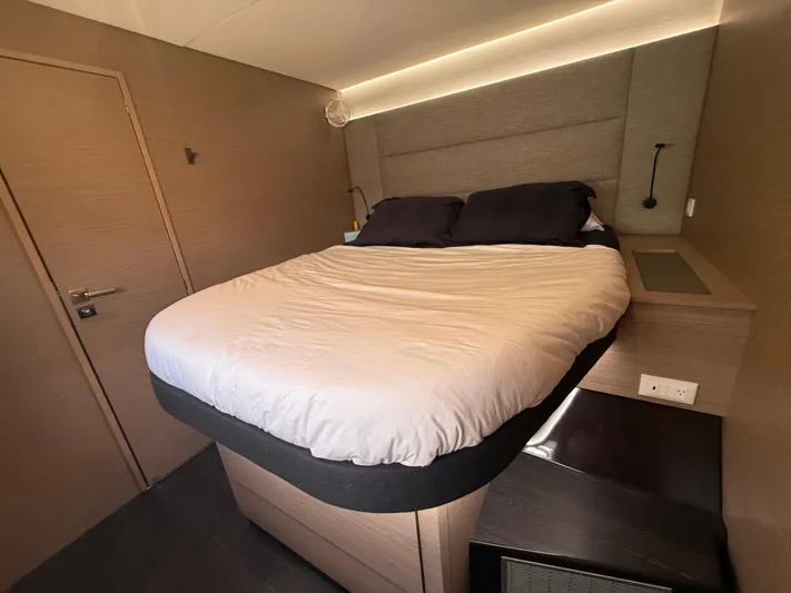 Darla Jay Yacht Photos Pics Luxurious bedroom interior of 2023 Fountaine Pajot Aura 51 yacht with modern design.