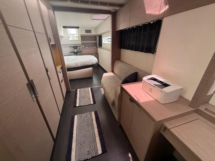 Darla Jay Yacht Photos Pics Luxurious interior of 2023 Fountaine Pajot Aura 51 yacht with modern furnishings and cozy bedroom.