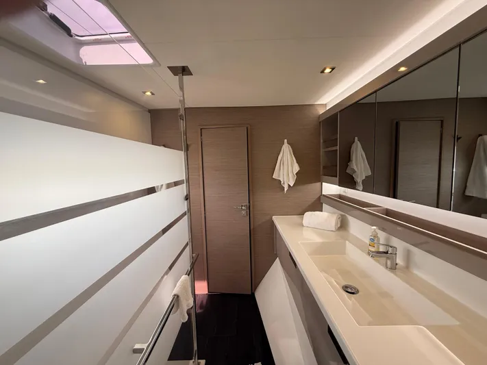 Darla Jay Yacht Photos Pics Modern bathroom interior of 2023 Fountaine Pajot Aura 51 yacht, featuring sleek design and amenities.