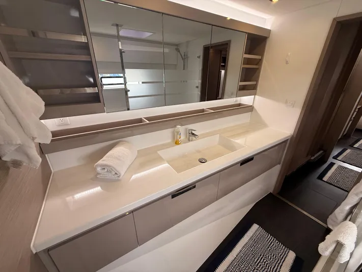 Darla Jay Yacht Photos Pics Modern bathroom interior of 2023 Fountaine Pajot Aura 51 yacht, featuring sleek design and amenities.