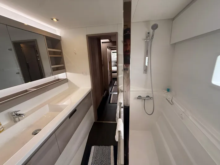 Darla Jay Yacht Photos Pics Luxurious bathroom interior of 2023 Fountaine Pajot Aura 51 yacht, featuring modern fixtures and sleek design.