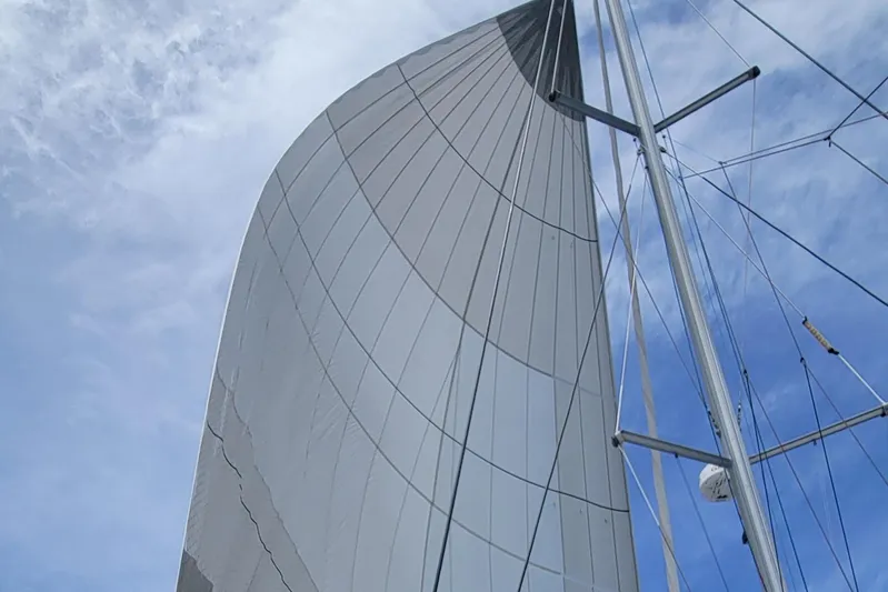 Darla Jay Yacht Photos Pics Sail of 2023 Fountaine Pajot Aura 51 catamaran against a blue sky.