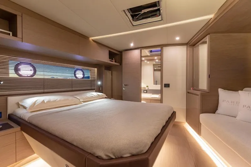  Yacht Photos Pics Luxurious bedroom interior of 2026 Pardo Yachts GT52, featuring modern design and ambient lighting.