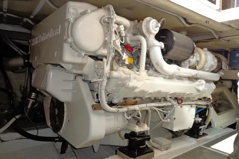  Yacht Photos Pics Engine room of 2003 Ferretti Yachts 620, featuring a powerful marine diesel engine.