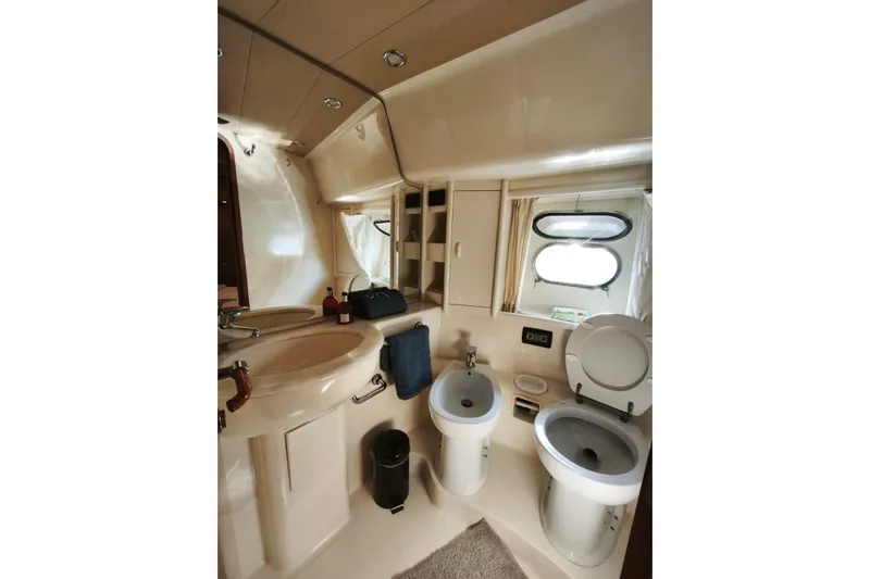  Yacht Photos Pics Luxurious bathroom in 2003 Ferretti Yachts 620, featuring modern fixtures and elegant design.