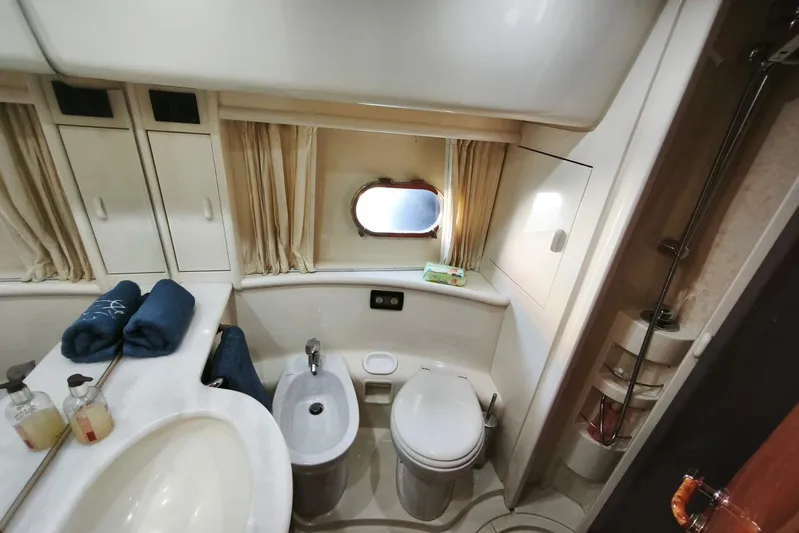  Yacht Photos Pics Luxurious bathroom in 2003 Ferretti Yachts 620, featuring modern fixtures and elegant design.