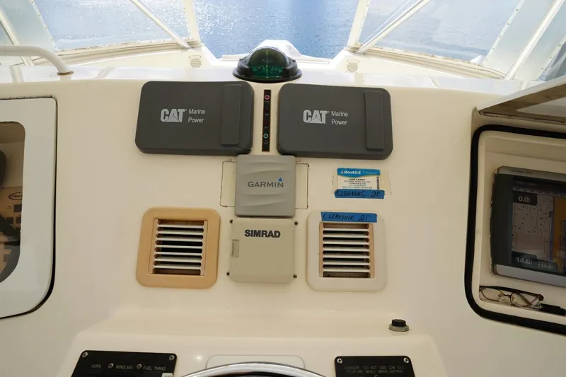 Etan Yacht Photos Pics Control panel of a 2005 Ocean Yachts 50 Super Sport with CAT Marine Power and Garmin systems.