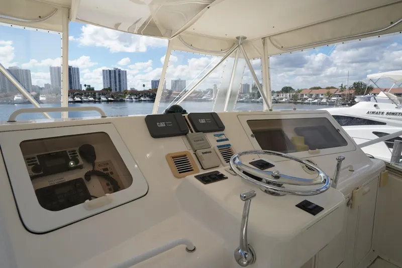 Etan Yacht Photos Pics Helm of 2005 Ocean Yachts 50 Super Sport with waterfront view and modern controls.