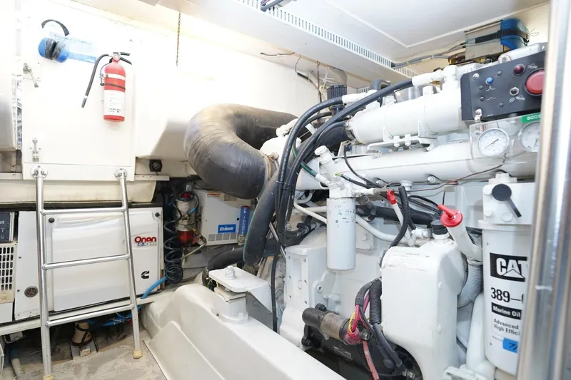 Etan Yacht Photos Pics Engine room of 2005 Ocean Yachts 50 Super Sport with CAT marine engine and Onan generator.