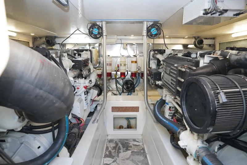 Etan Yacht Photos Pics Engine room of 2005 Ocean Yachts 50 Super Sport, featuring dual Caterpillar engines.