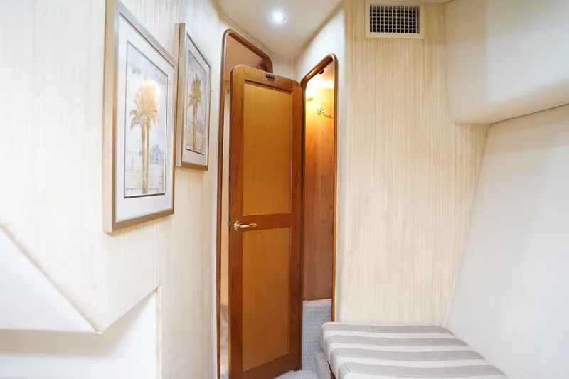 Etan Yacht Photos Pics Interior of 2005 Ocean Yachts 50 Super Sport with framed art and wooden door.