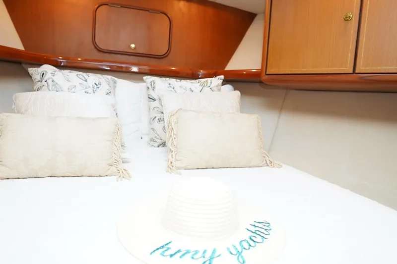 Etan Yacht Photos Pics Luxurious cabin interior of 2005 Ocean Yachts 50 Super Sport with elegant bedding.